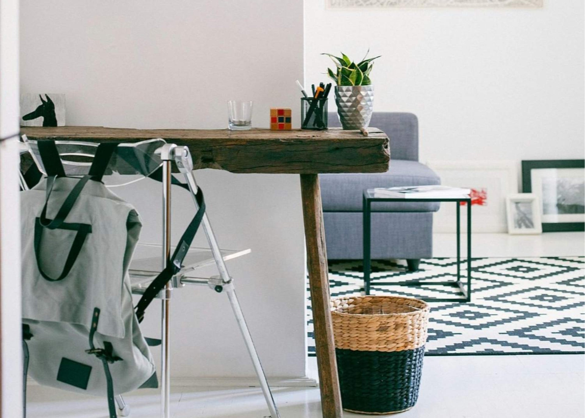 Modern living room with wooden desk, organized work space, eco-friendly natural lighting, efficient living and focus.